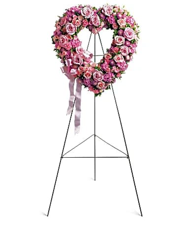 Pink rose heart-shaped standing floral wreath on an easel