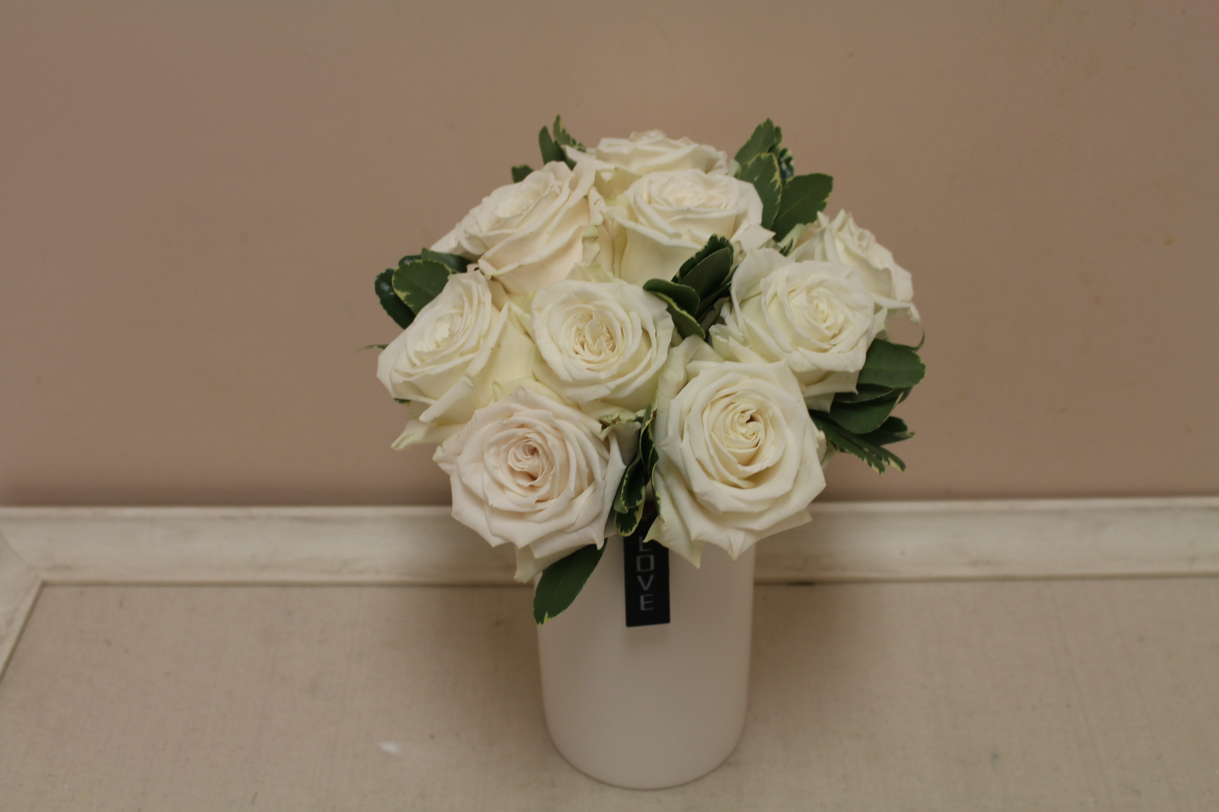 White rose bouquet in a white vase