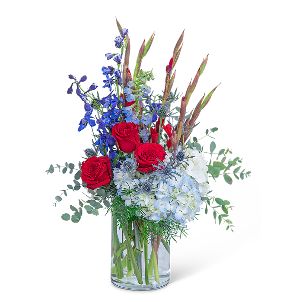 Home of the Brave - Home of the Brave is a popular choice for flowers for Memorial Day or Independence Day and is beautifully shown in red, white, and blue flowers. This patriotic theme is accomplished with Roses, Gerbera, Gladiolus, Hydrangea, Delphinium, Stock, and other premium foliage. Home of the Brave would also be a beautiful tribute to send for a military funeral or for the funeral of a veteran.