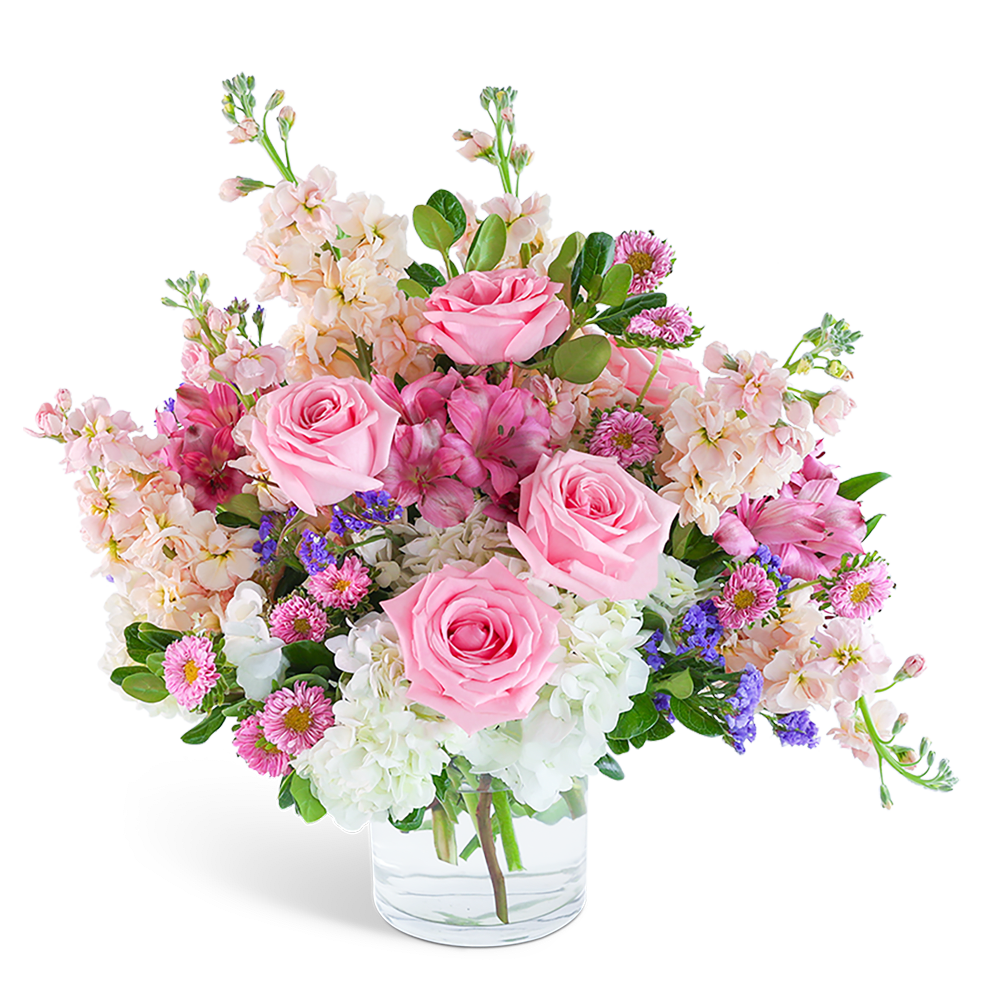 Celestial Cloudscape - "Spread love and joy with our exquisite Celestial Cloudscape flower design. Delicate pink roses, Alstroemeria, and Hydrangea are artfully arranged in a clear glass vase, creating a beautiful and tender look that is sure to bring a smile to anyone's face. With its pop of pastel colors, this unique flower arrangement is perfect for adding a touch of soft elegance to any occasion.   Our floral inventory changes with the seasons and market availability. These images are indicative of our general size &amp; style. We can offer same-day flower delivery in most cases. If you are sending the bouquet directly to your recipient, please provide the complete address and contact information so that we can deliver the flowers directly to them."