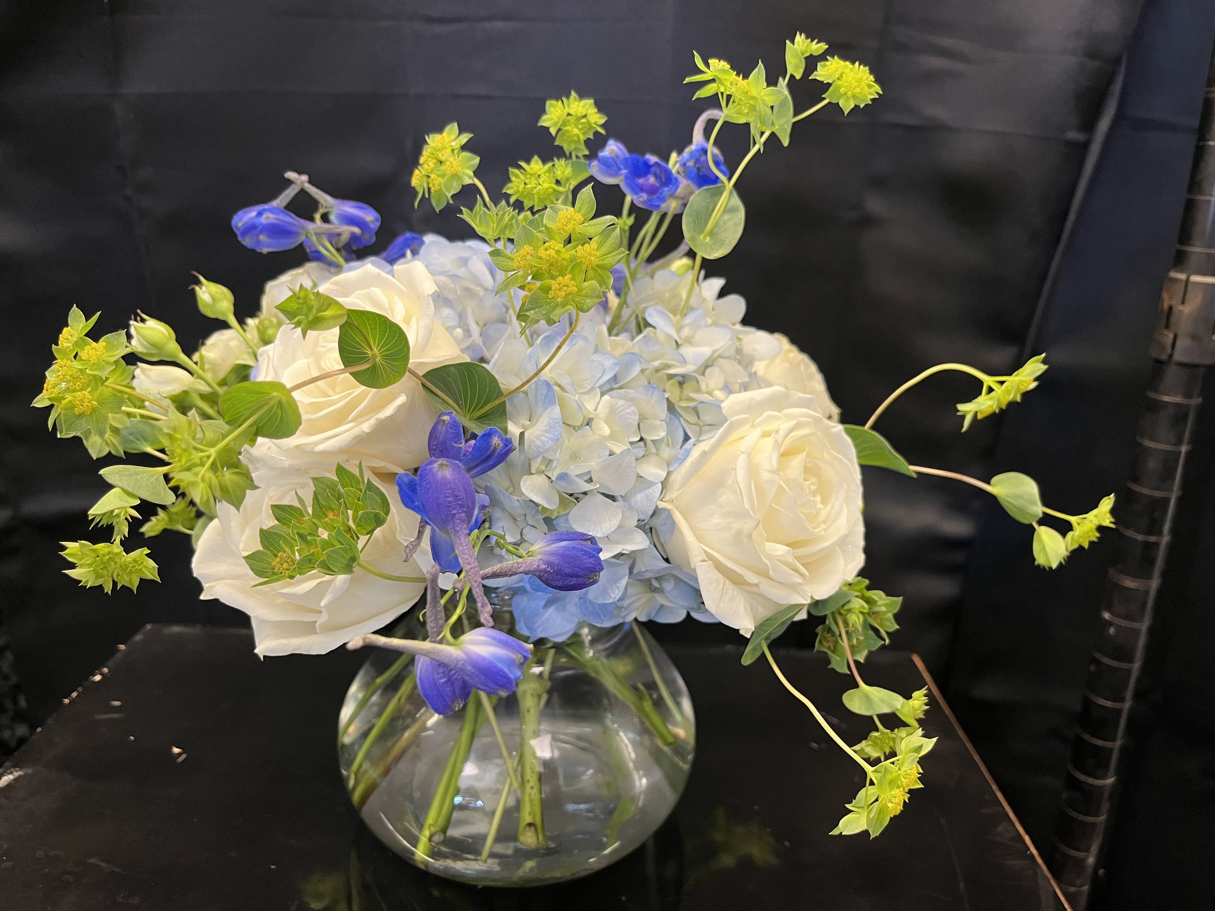 Sincere Elegance - A simple, yet sophisticated arrangement with white and blue colors. Order for any occasion!