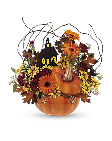 Haunted House Bouquet - What a boo-tiful way to get in the Halloween spirit! This lush mix of gerberas, carnations and daisies surrounds a spooky house in an adorable ceramic pumpkin jar - the perfect keepsake candy container and fall décor favorite for years to come!