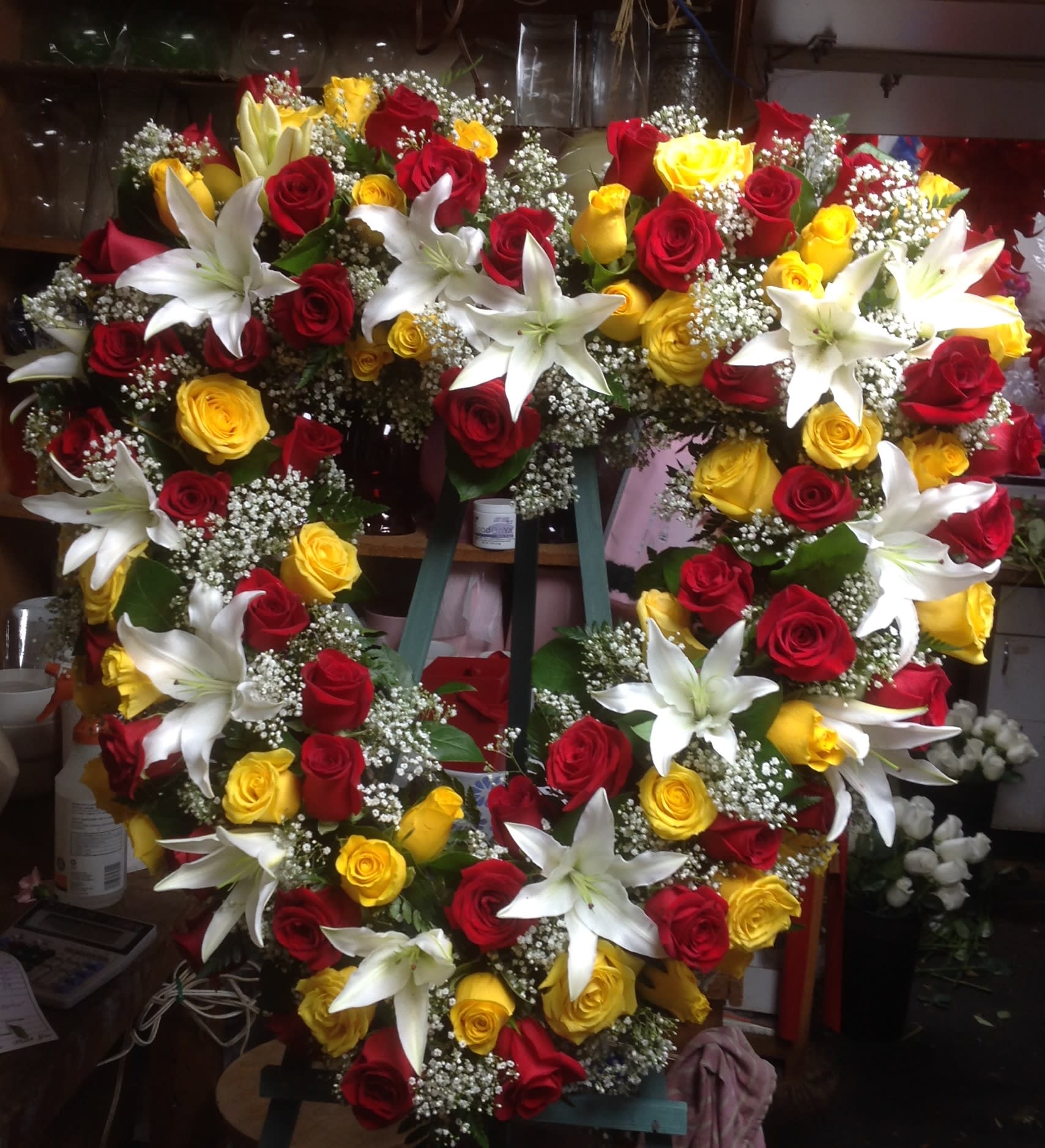 FROM YOUR HEART - SYM-259 - A red, yellow, and white open heart sympathy arrangement.   *Picture is showing the Premium Size.*
