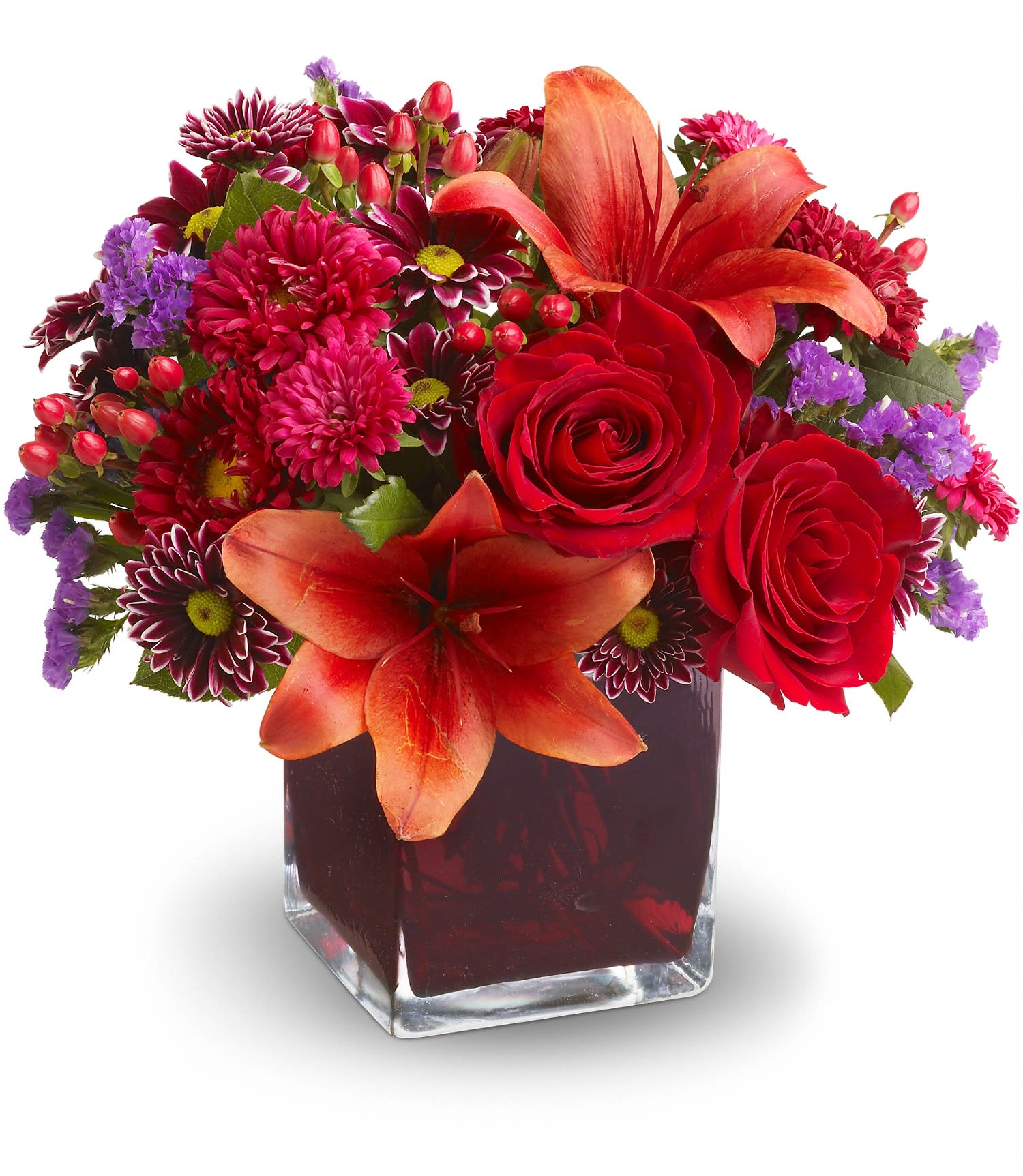 Autumn Grace - Roses, lilies and asters in precious gemstone colors of garnet are nestled into a richly colored plum glass cube vase, creating a graceful presentation. Purple chrysanthemums and seafoam statice add a special touch. A beautiful bouquet for any occasion!   Red roses, Asiatic lilies, Matsumoto asters and hypericum; purple daisy spray chrysanthemums and seafoam statice are delivered in a plum glass cube vase. Approximately 11" W x 10" H 