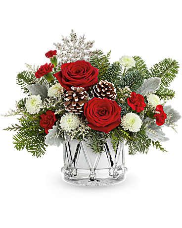Little Drummer Joy Bouquet - Little Drummer Joy Bouquet marches in the holiday cheer with red roses, wintery greens, and festive white blooms in OSG Crystal Drum Vase. A joyful gift for any Christmas celebration.  Little Drummer Joy Bouquet includes red roses, red miniature carnations, white button spray chrysanthemums, and white Limonium. Accented with cedar, dusty miller, and noble fir in Teleflora's Crystal Drum Vase Orientation: All-Around 