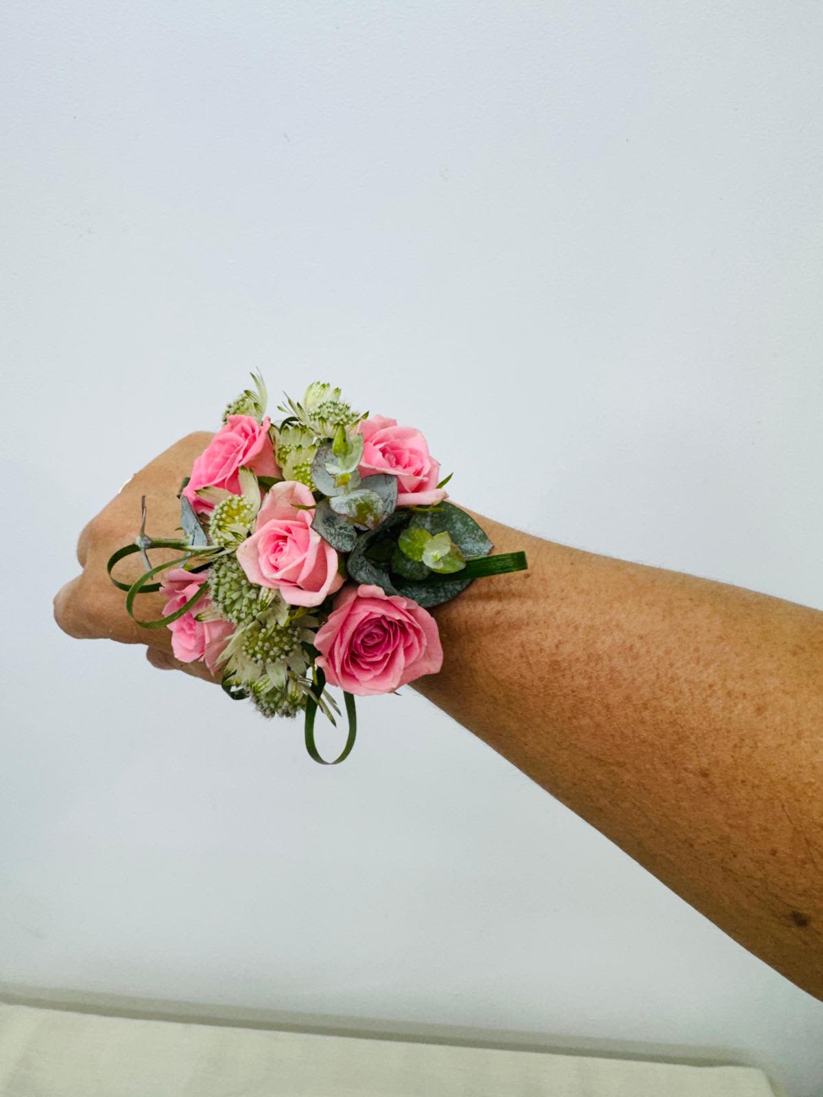  Pink  rose and green filler Corsage. - A classic  pink rose and baby's breath corsage compliments any outfit. Perfect for prom, formal, and weddings