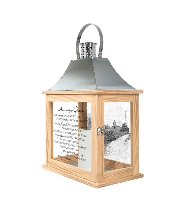 Wooden lantern with a metal top and printed glass panels