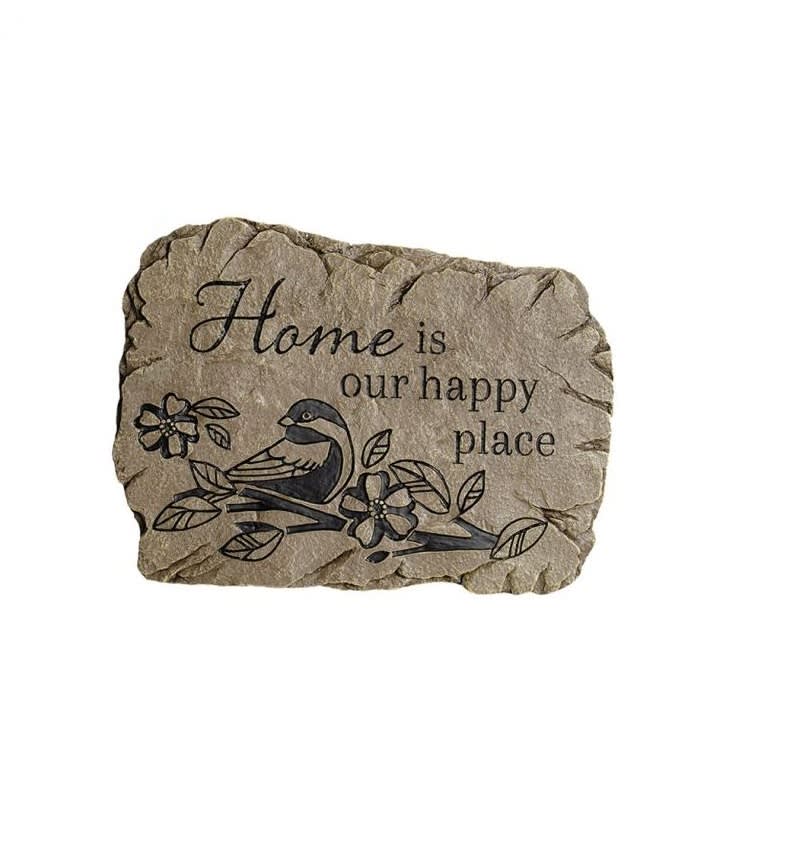 Decorative stone plaque with a bird and flowers and the words "Home is our happy place"
