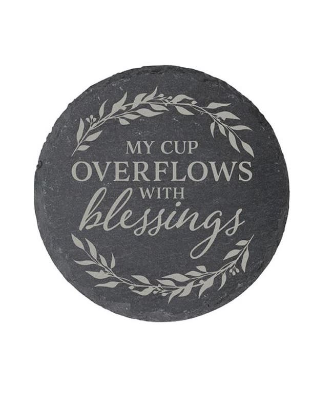 Round black stone plaque with the words "My cup overflows with blessings"