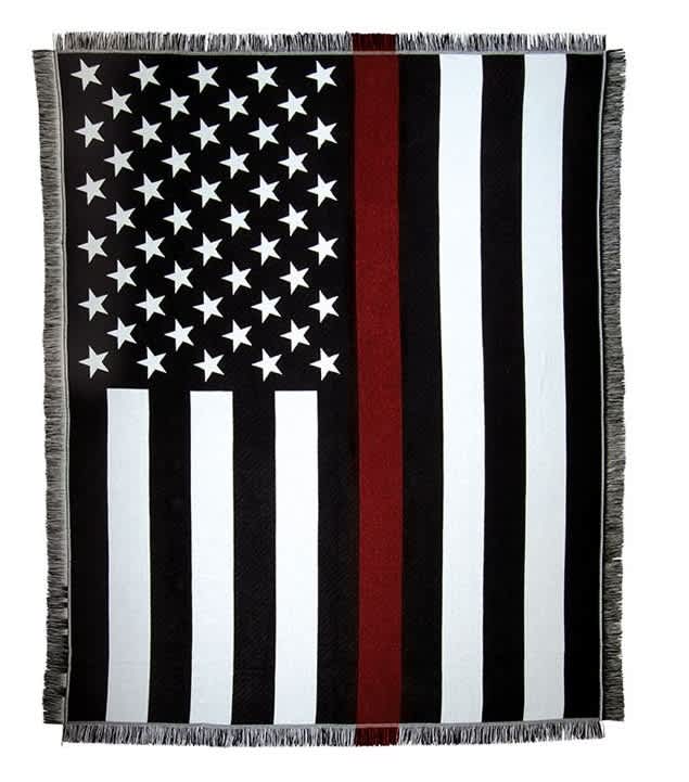 Black-and-white American flag blanket with a red stripe and fringe