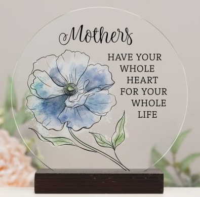 Round glass plaque with a blue flower illustration and Mother's quote