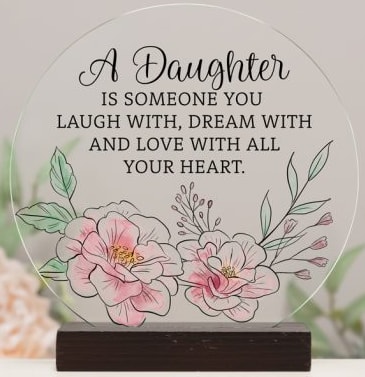 Decorative plaque with floral illustration and daughter quote on a wooden base