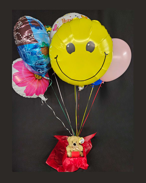 A Beary Big Bundle - Celebrate any important life event with this very big bear bundle! The Standard version comes with a small box of chocolates, a small teddy bear, 5 occasion specific mylar balloons, and 3 latex balloons. The Deluxe version (pictured) comes with a medium box of chocolates, a medium teddy bear, 5 occasion specific mylar balloons, and 3 latex balloons The Premium version comes with a large box of chocolates, a large teddy bear, 5 occasion specific mylar balloons, and 3 latex balloons.