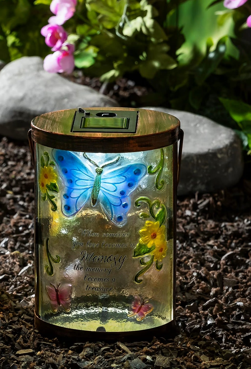Butterfly memorial lantern with floral accents and a quote