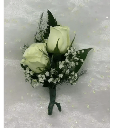 Two white rose buds with baby's breath in a small hand-tied bouquet