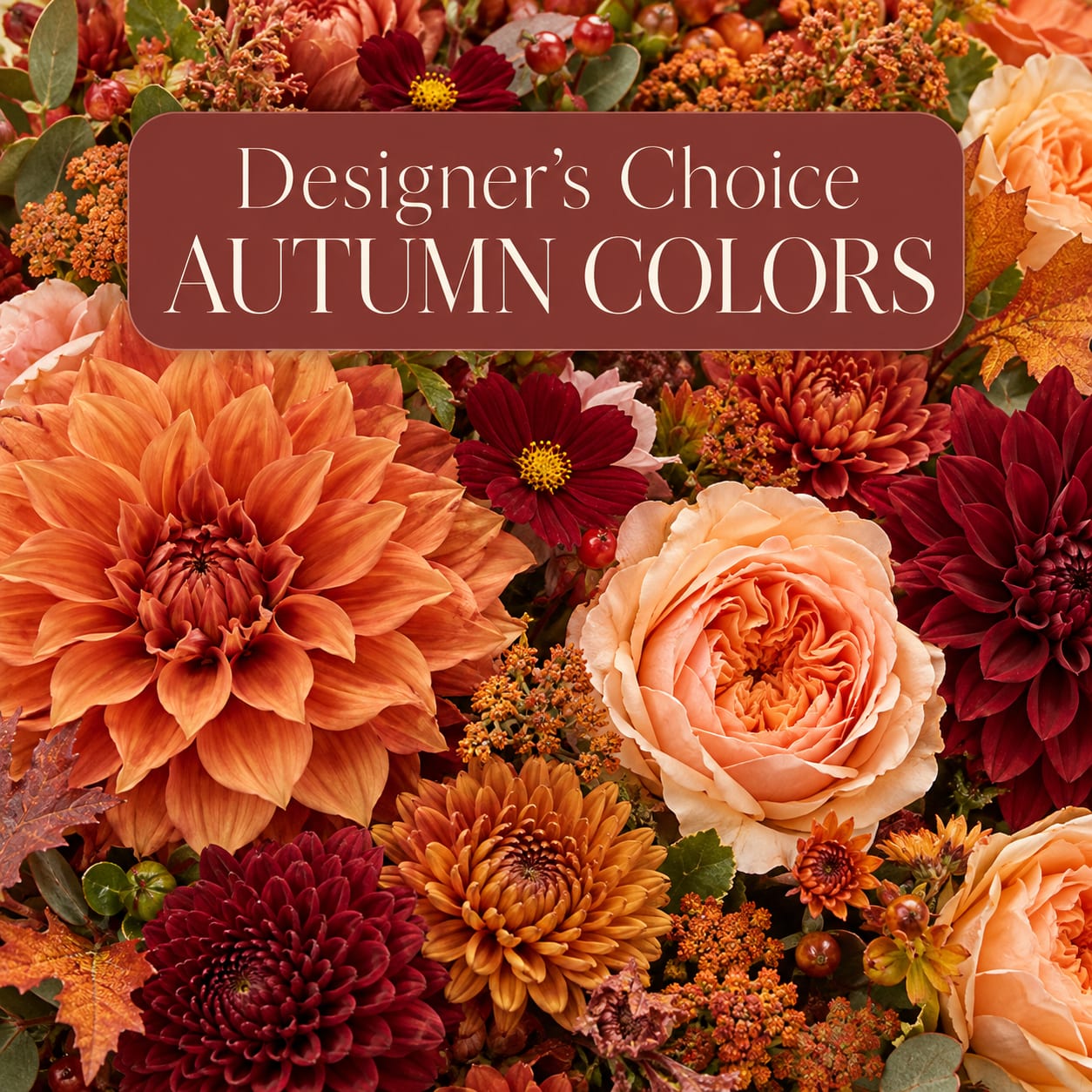 Autumn flower arrangement with orange, burgundy, and peach blooms