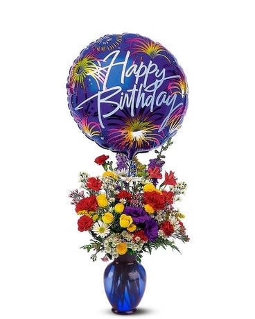 Birthday Fireworks - This explosion of colorful flowers, along with a foil balloon, adds just the right spark to every birthday celebration. Carnations, chrysanthemums and larkspur arrive in a blue glass vase with attached "Happy Birthday" message balloon.