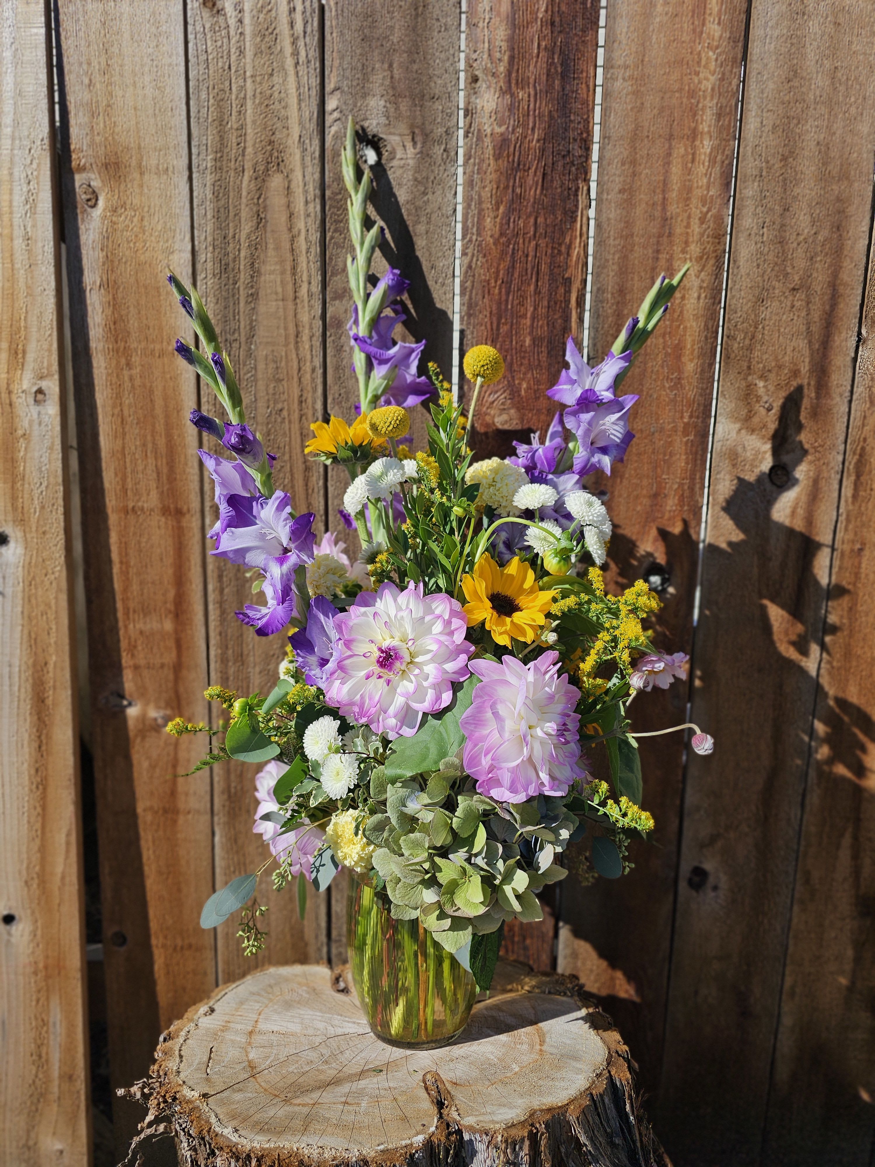 Reach for the stars - This beautifully arranged bouquet will include both tall elegant flowers and shorter bold and beautiful flowers.  