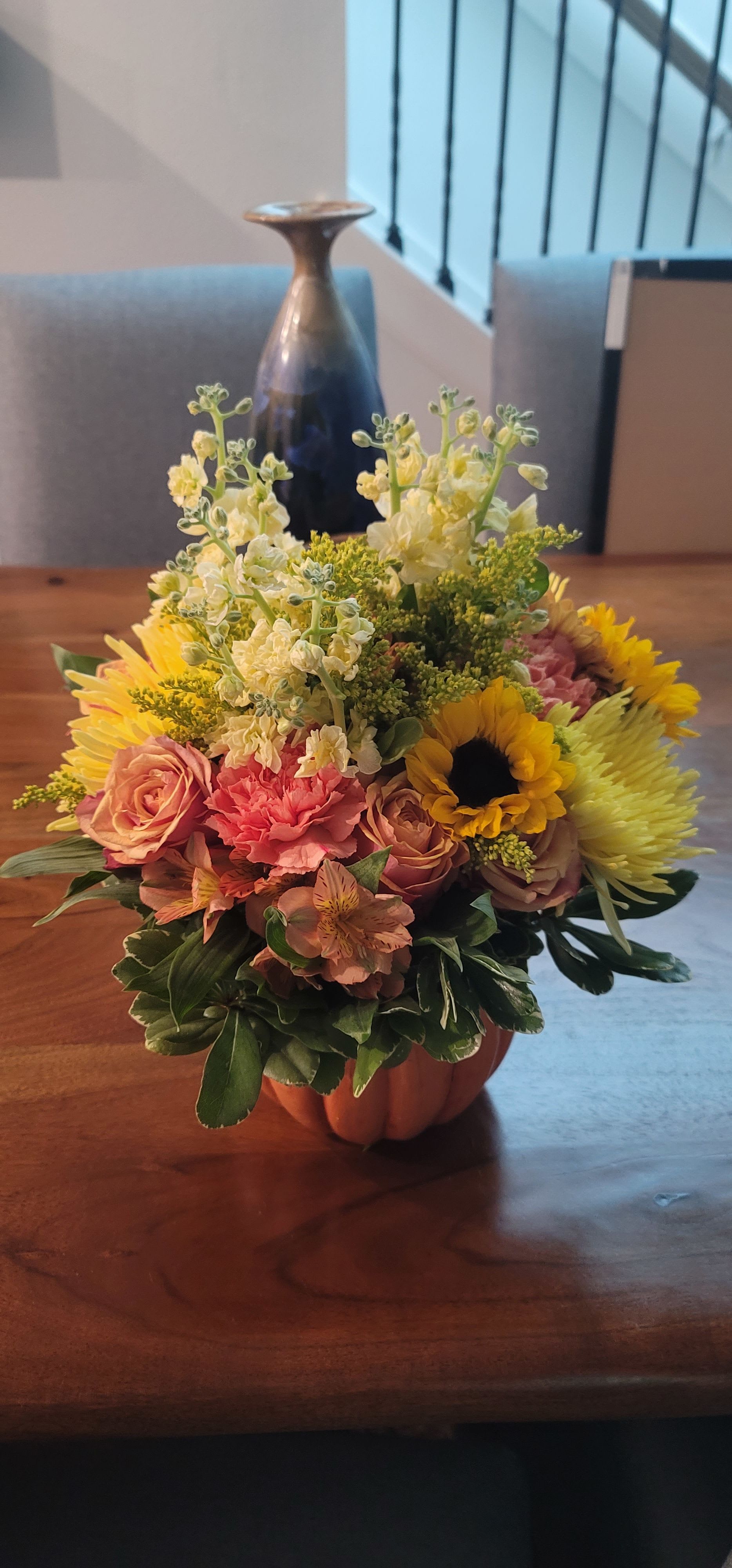 Pumpkin Time - Sunflower, Stock, Solidago, Alstro, Carnations, Roses and more in this fall pumpkin arrangement that is sure to add a bit of sunshine to someone's day!