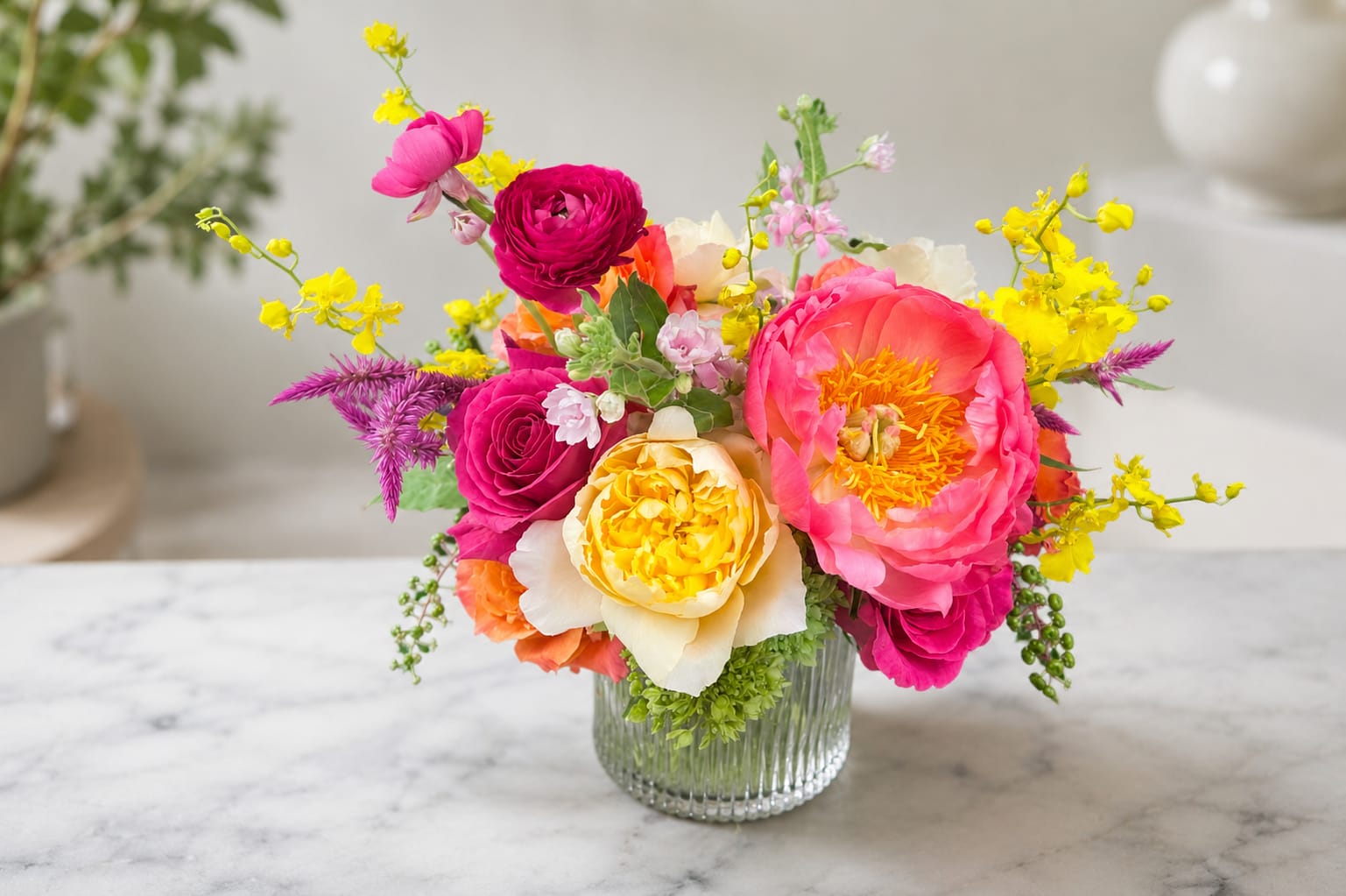 Summer Luxe - Our floral artisans thoughtfully design each arrangement using premium seasonal blooms and locally sourced botanicals whenever possible. Due to availability, substitutions may occur, but we will always preserve the color palette, style, and overall beauty of the design using flowers and vessels of equal or greater value. Every arrangement is uniquely created, ensuring a one-of-a-kind floral experience.