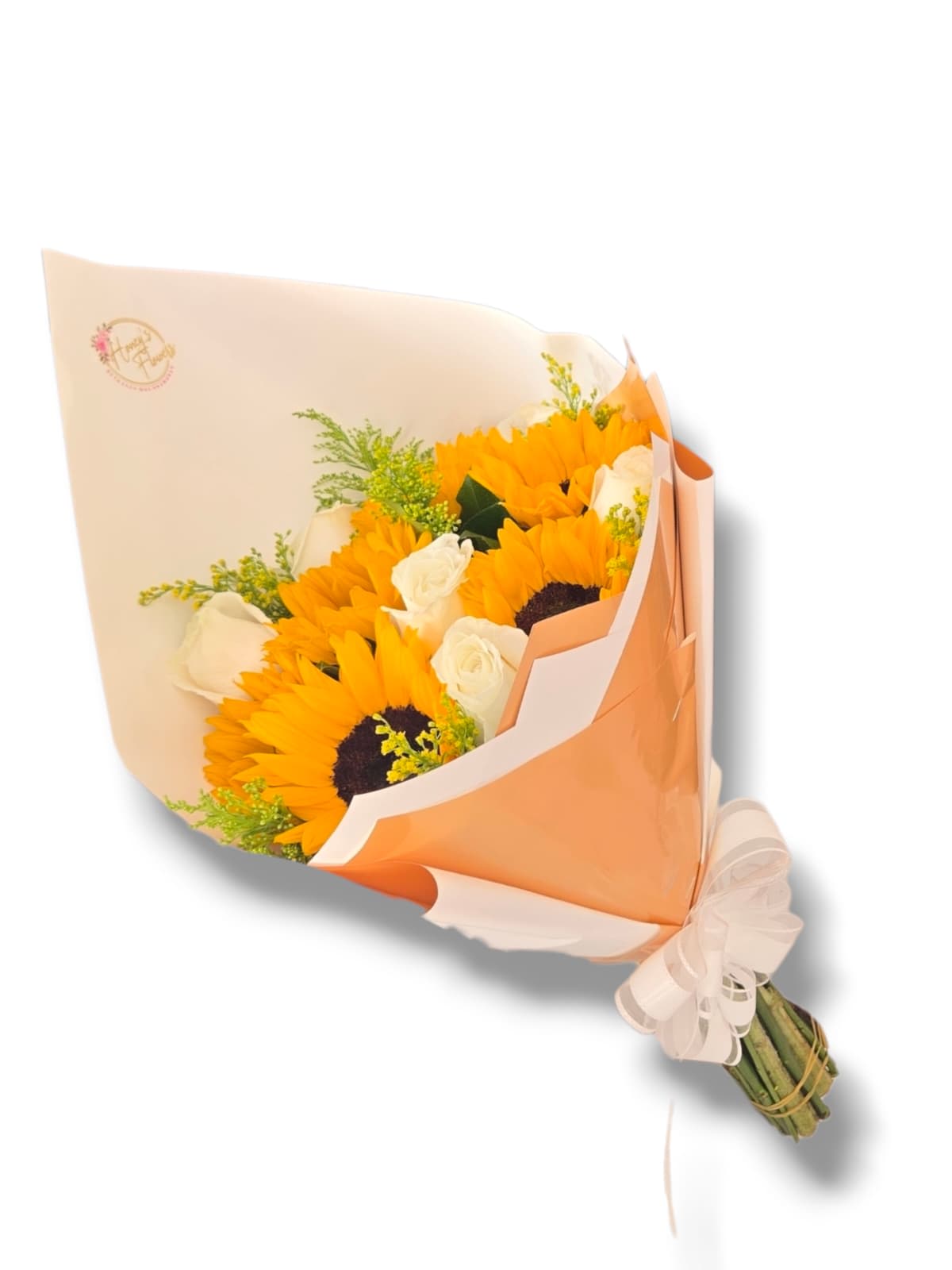 Bouquet of sunflowers and white roses wrapped in peach paper