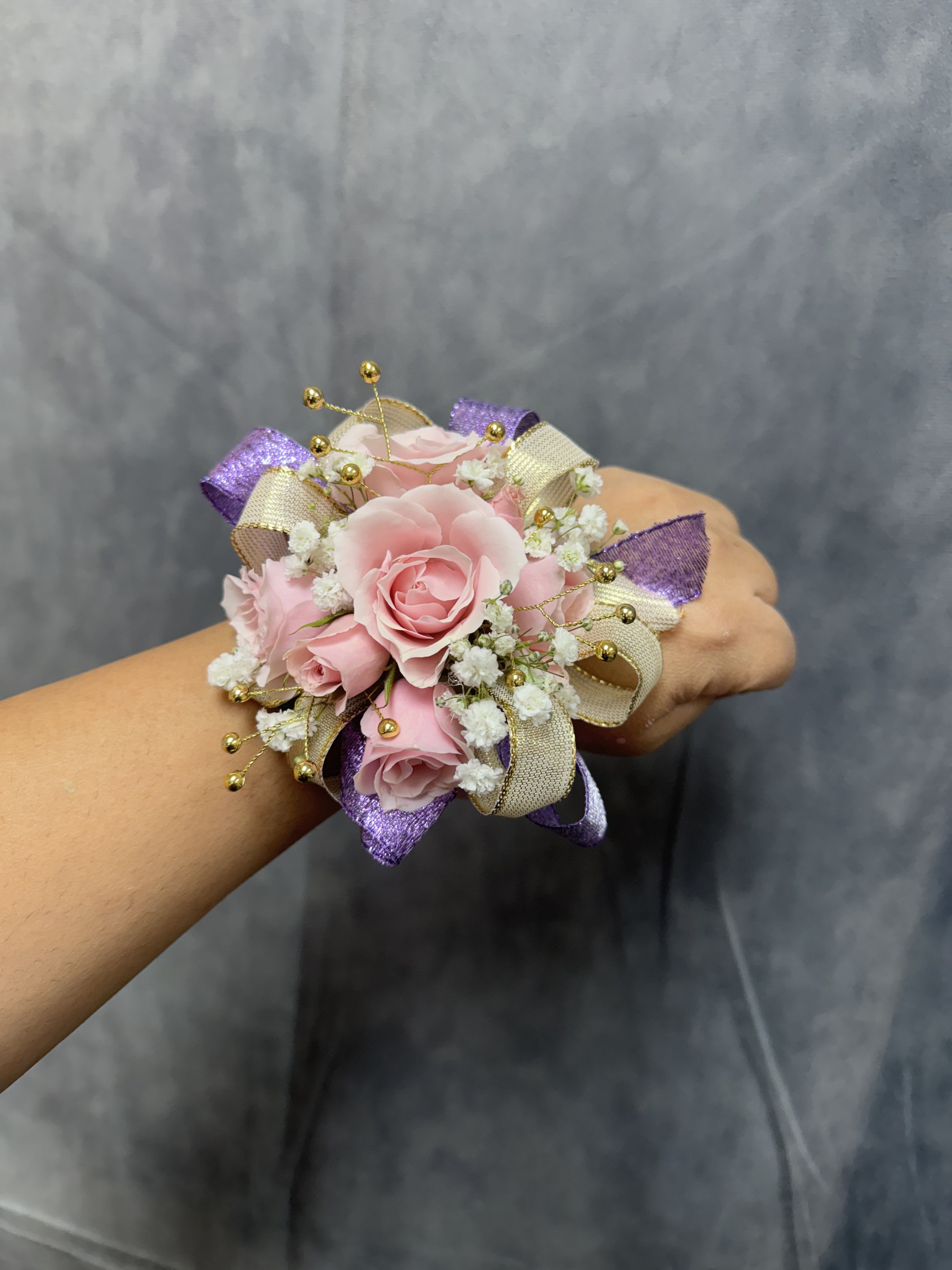 Purple Gold Pink Spray roses corsage - White spray roses with purple , gold ribbon and gold accents round corsage with pearl bracelet 