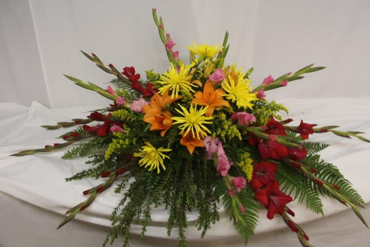 Colorful floral centerpiece with red, orange, and yellow blooms