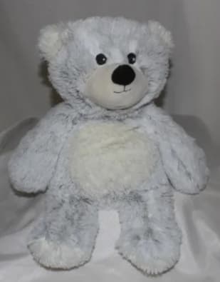 White plush teddy bear with black eyes and nose
