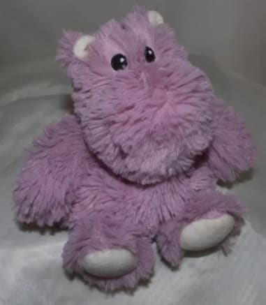 Purple plush hippo toy with white feet and ears