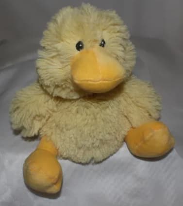 Plush yellow duck toy with orange beak and feet