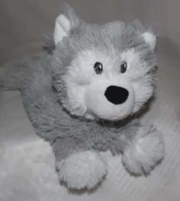 Gray and white plush husky toy with black eyes and nose