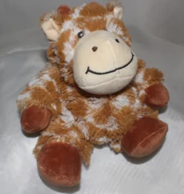 Plush giraffe toy with a smiling face and brown-and-white fur