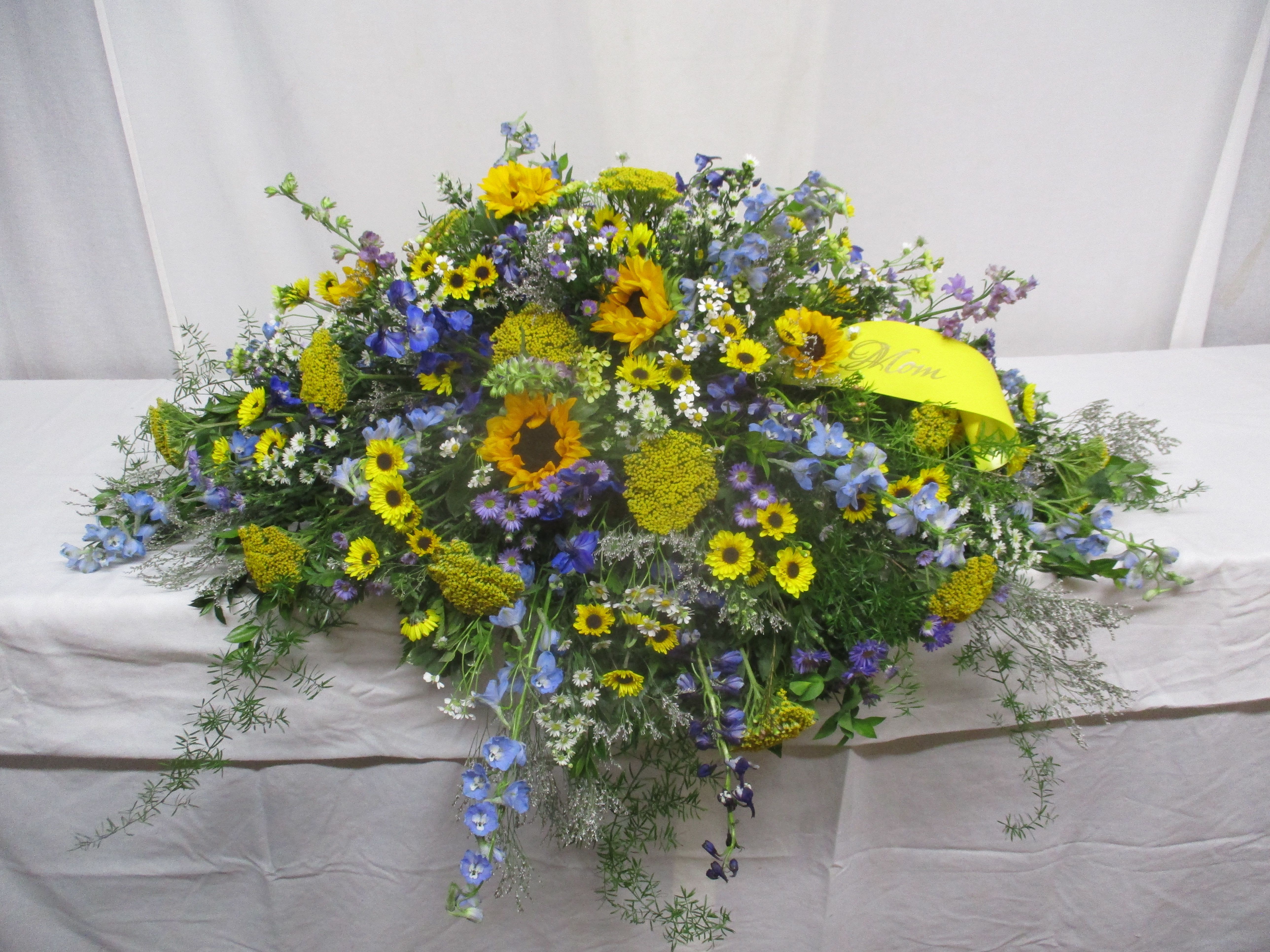 Large mixed bouquet with yellow sunflowers and blue flowers