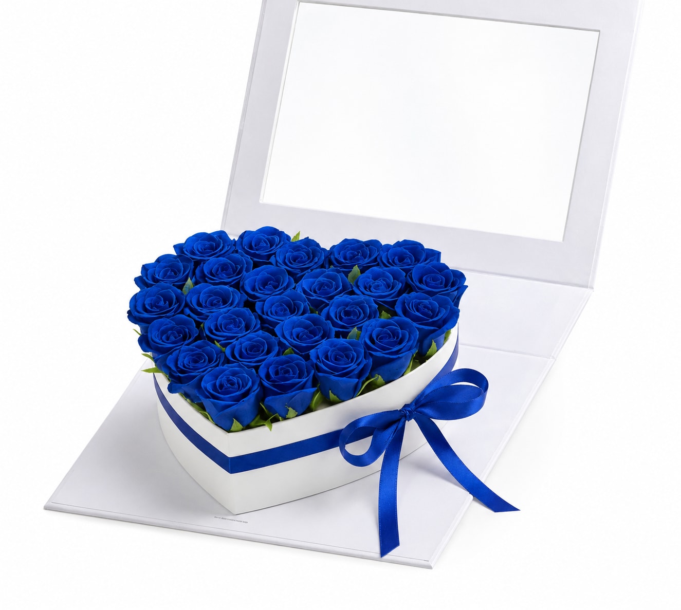 Blue Eternal Rose Heart Box - Make every moment unforgettable with our Blue Eternal Rose Heart Box. This elegant heart-shaped box showcases stunning artificial blue roses, carefully arranged to create a sophisticated and luxurious presentation.  Unlike fresh flowers, these artificial roses maintain their beauty for years, making this arrangement a meaningful keepsake that can be displayed and enjoyed long after the occasion has passed. The elegant white box and satin blue ribbon add a refined finishing touch, perfect for birthdays, anniversaries, Father’s Day, graduations, or simply showing someone how much they mean to you.  Features: • Premium artificial blue roses (not fresh flowers) • Elegant heart-shaped keepsake box • Long-lasting decorative arrangement • No watering or maintenance required • Perfect for gifting and home décor  Please Note: This arrangement contains artificial roses and is intended as a long-lasting decorative gift. 