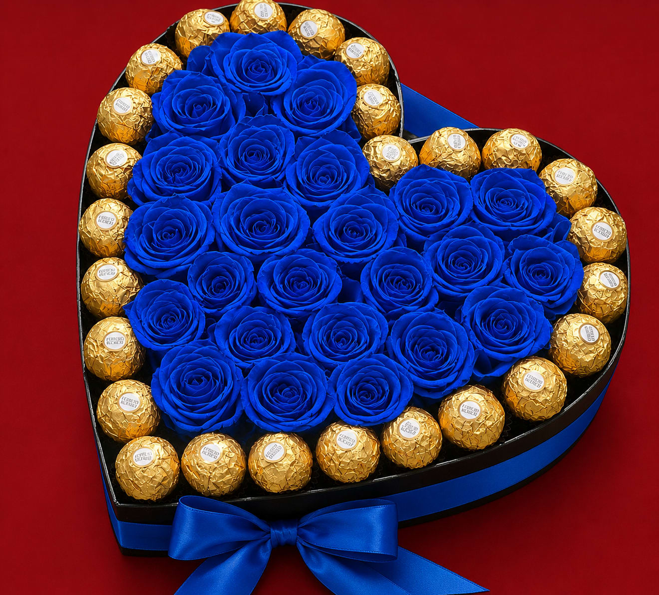 Luxury Heart Rose &amp; Chocolate Box – Artificial Blue Roses - Celebrate life’s special moments with our Luxury Heart Rose &amp; Chocolate Box. This elegant heart-shaped arrangement features stunning artificial blue roses beautifully paired with Ferrero Rocher chocolates for a sophisticated and unforgettable presentation.  Unlike fresh flowers, these artificial roses maintain their beauty over time, making this arrangement a lasting keepsake that can be enjoyed for years. Perfect for birthdays, anniversaries, Father’s Day, Mother’s Day, Valentine’s Day, or any meaningful celebration.  Features: • Premium artificial blue roses (not fresh flowers) • Ferrero Rocher chocolates included • Elegant heart-shaped gift box • Long-lasting decorative keepsake • No watering or maintenance required