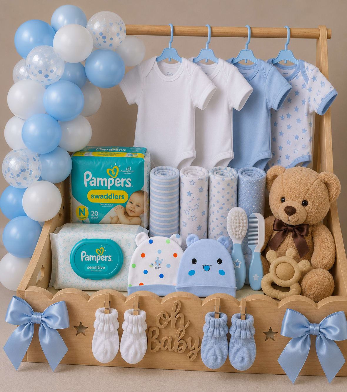 Baby gift basket with onesies, diapers, teddy bear, and blue balloons