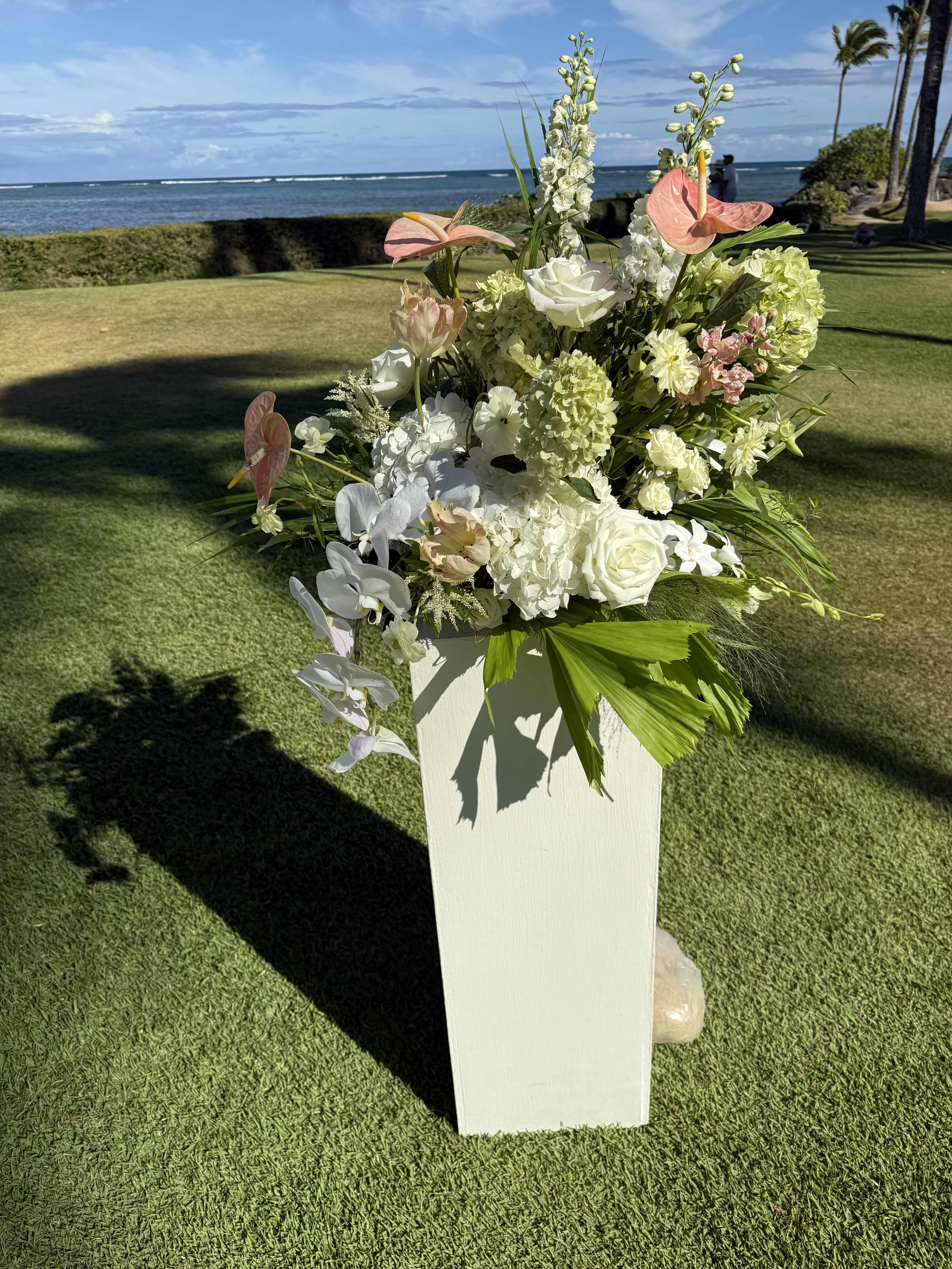 "Pedestal Set" with Floral Decor (price for 2 pieces) - Pedestals rentals are $50 each. Large in season green and white floral arrangements to sit on top. 4 day minimum pre-order.