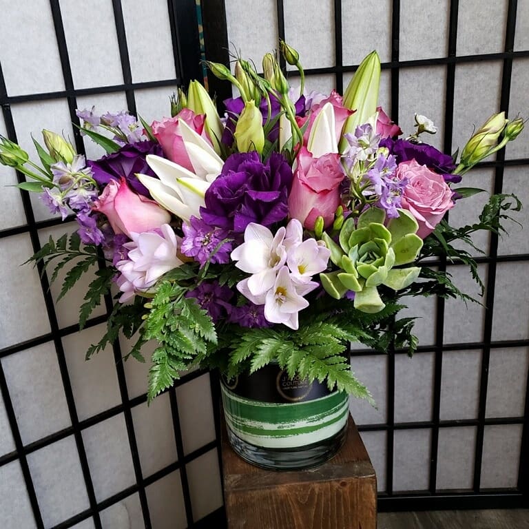 Bouquet of pink and purple flowers in a glass vase