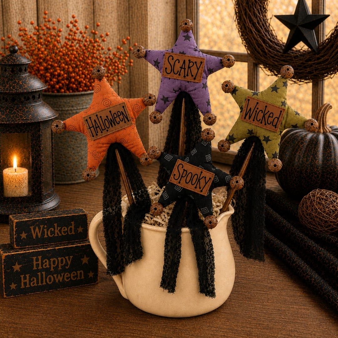 Halloween star ornaments in a cream pitcher with spooky signs