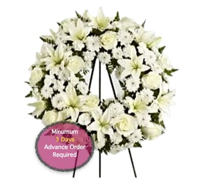 White funeral wreath on a standing easel