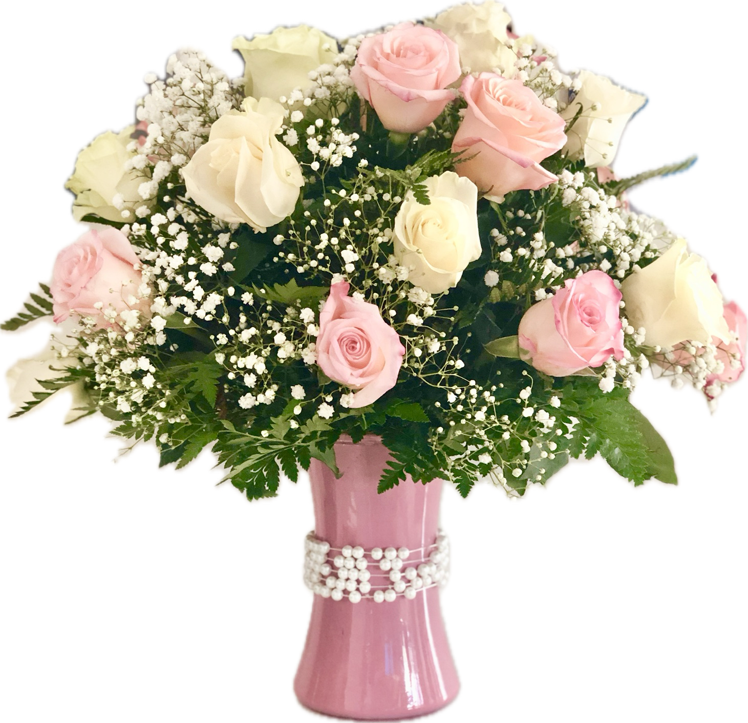 Pink and white roses in a pink vase with baby's breath