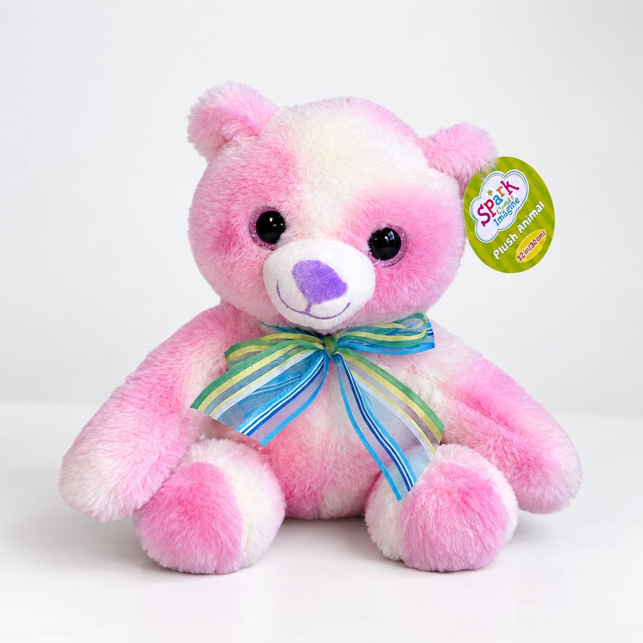 Pink and white plush teddy bear with a striped ribbon bow