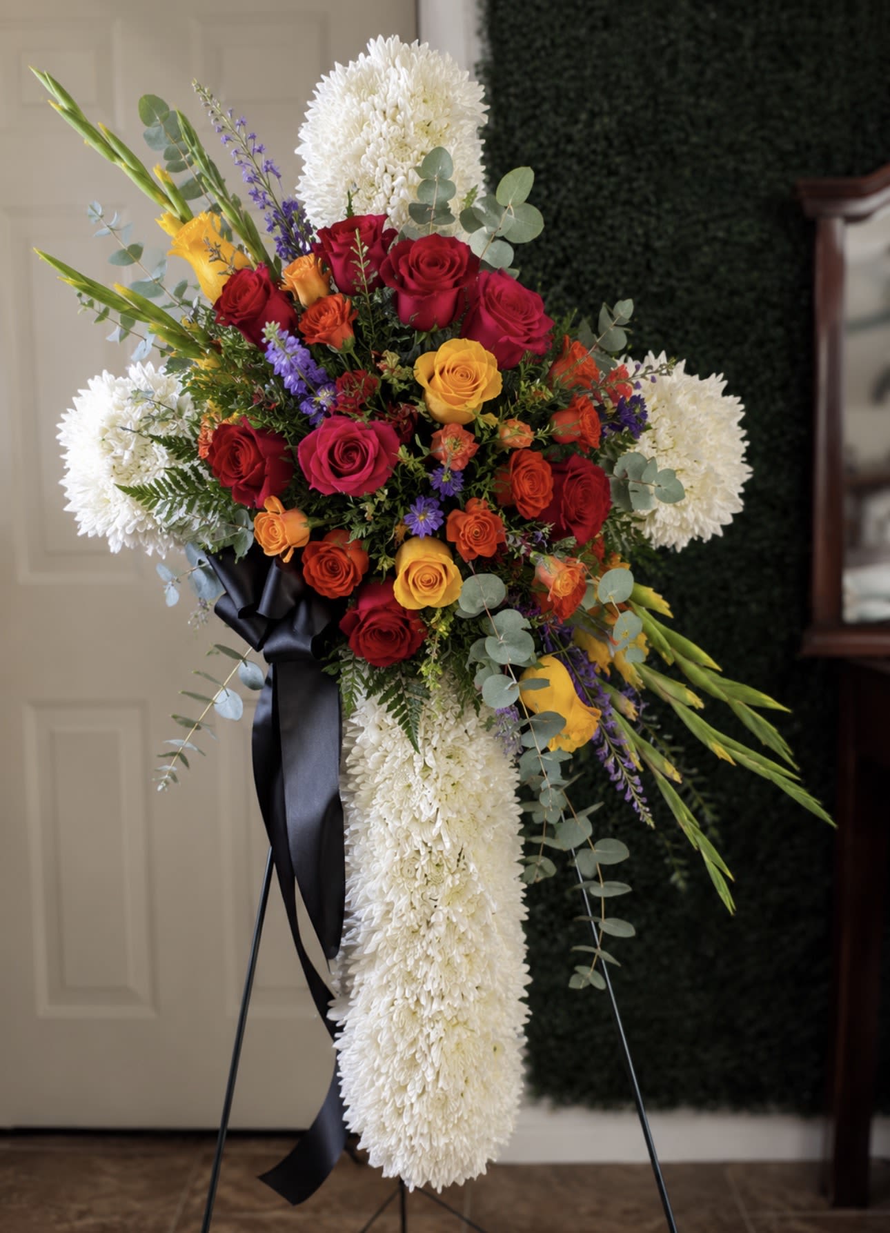 Colorful Cross - Every arrangement is handcrafted just for you. We carefully select the freshest flowers available each day. Occasionally, substitutions may be necessary due to seasonal or market availability, but we always replace them with flowers of equal or greater value in the same color palette and style. Your arrangement will always be beautiful, fresh, and thoughtfully designed.
