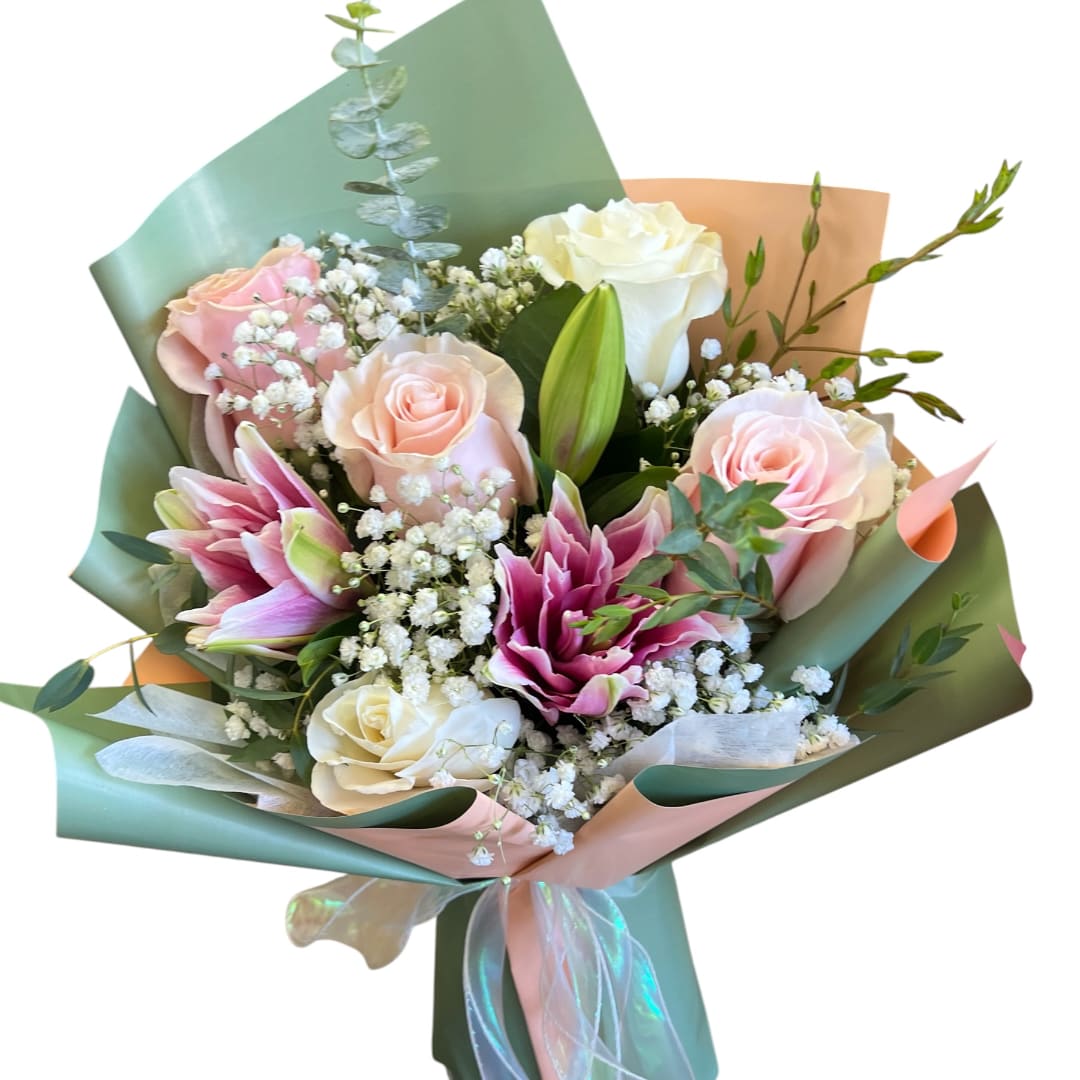 Bouquet of pink and white roses with lilies and baby's breath