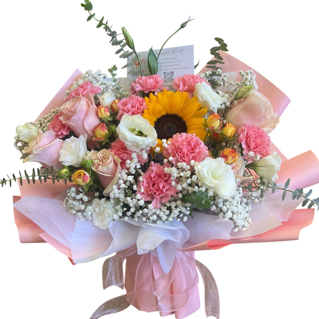 Bouquet of pink and white flowers with a sunflower in pink wrapping