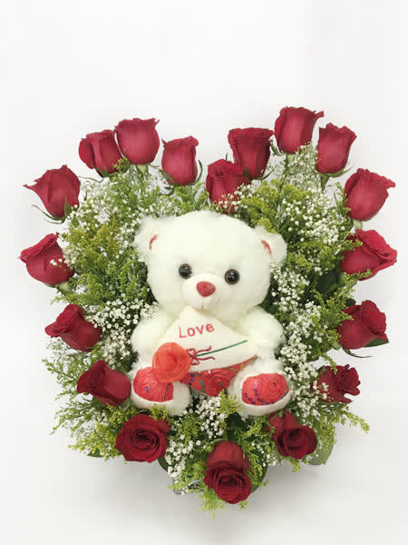 You got my heart (Red) - Show how much you love that special person by sending this arragement of 18 roses in a heart shape with a teddy bear in the center.