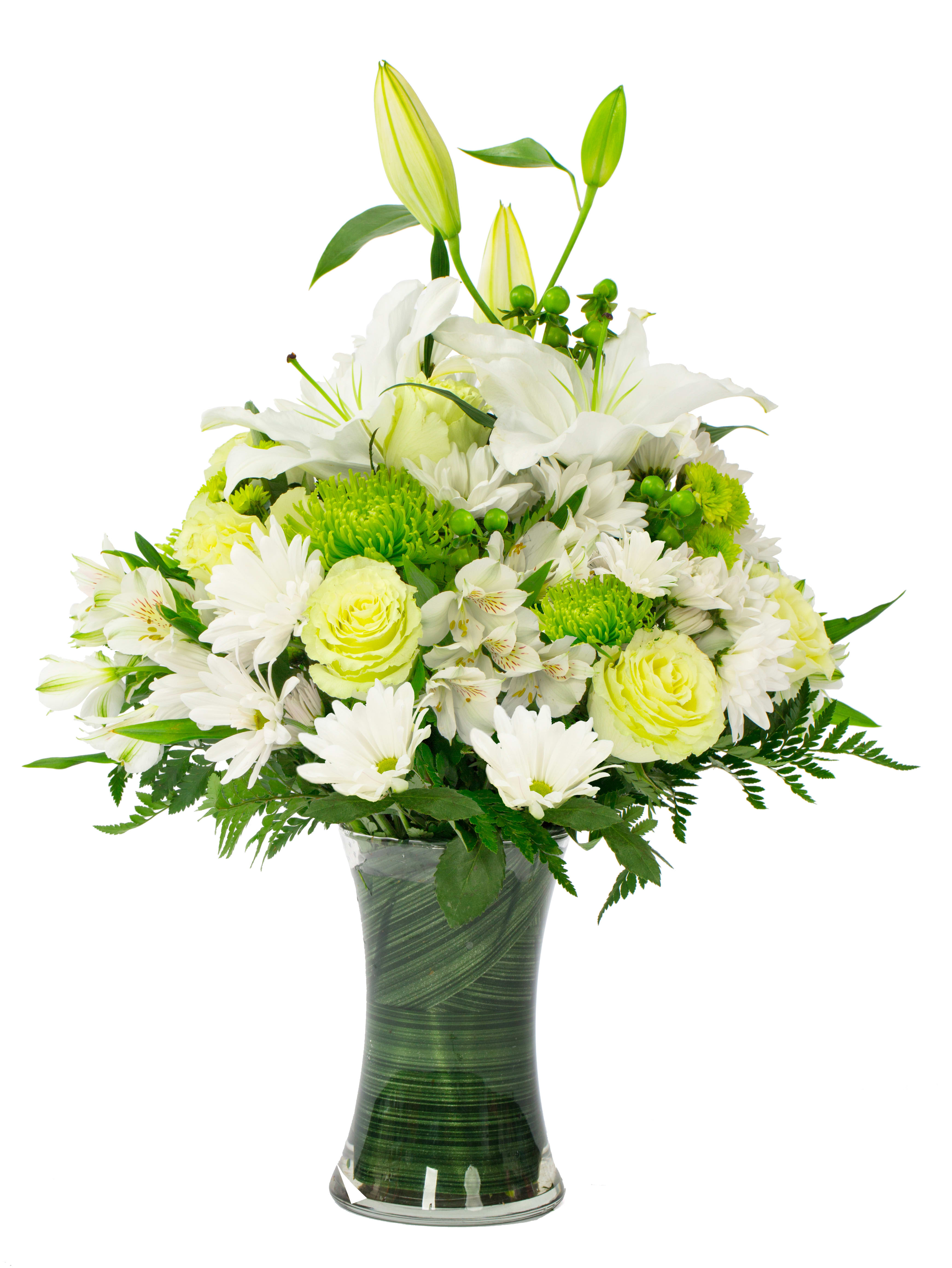 White lilies and daisies in a glass vase with green accents