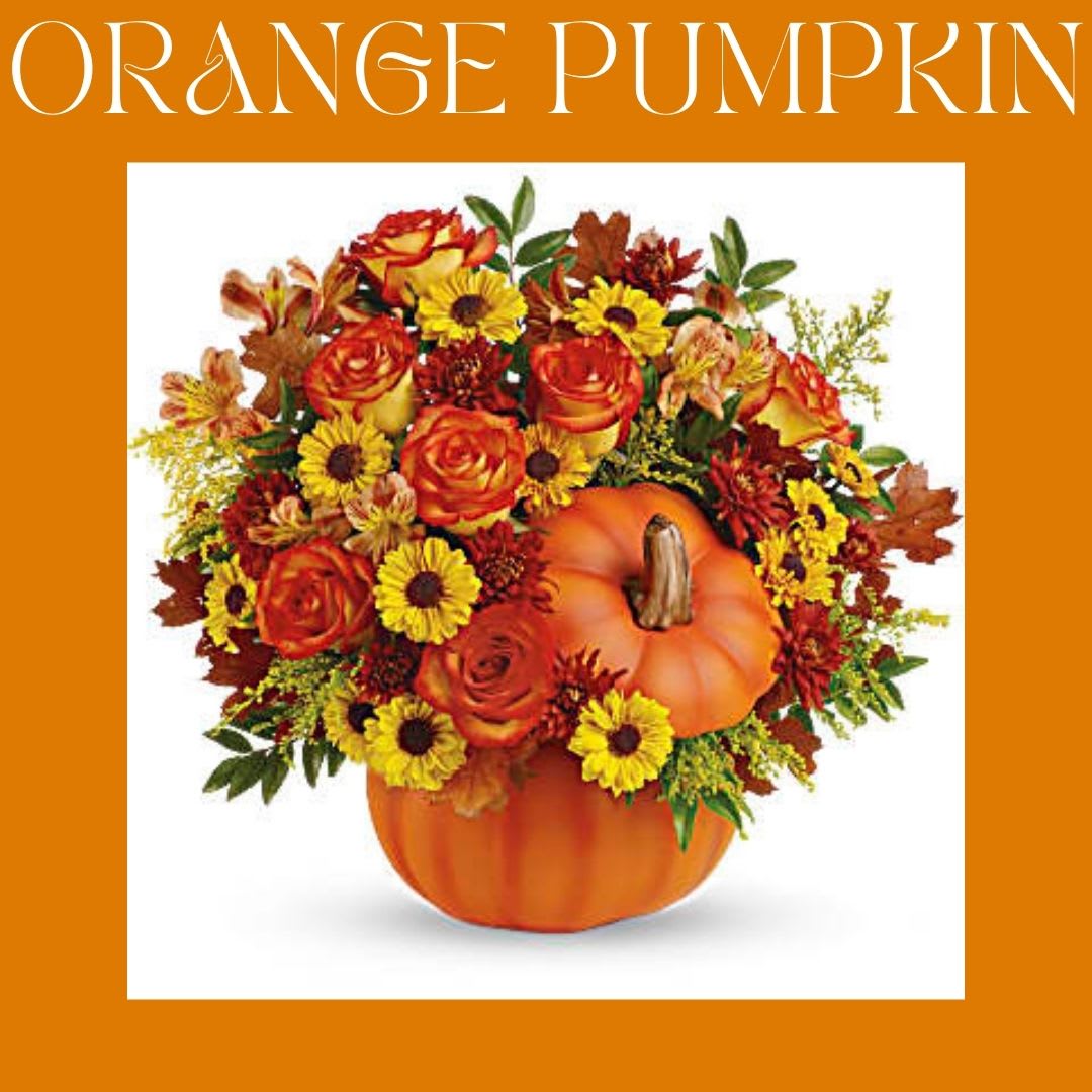 Orange pumpkin-shaped vase filled with autumn flowers