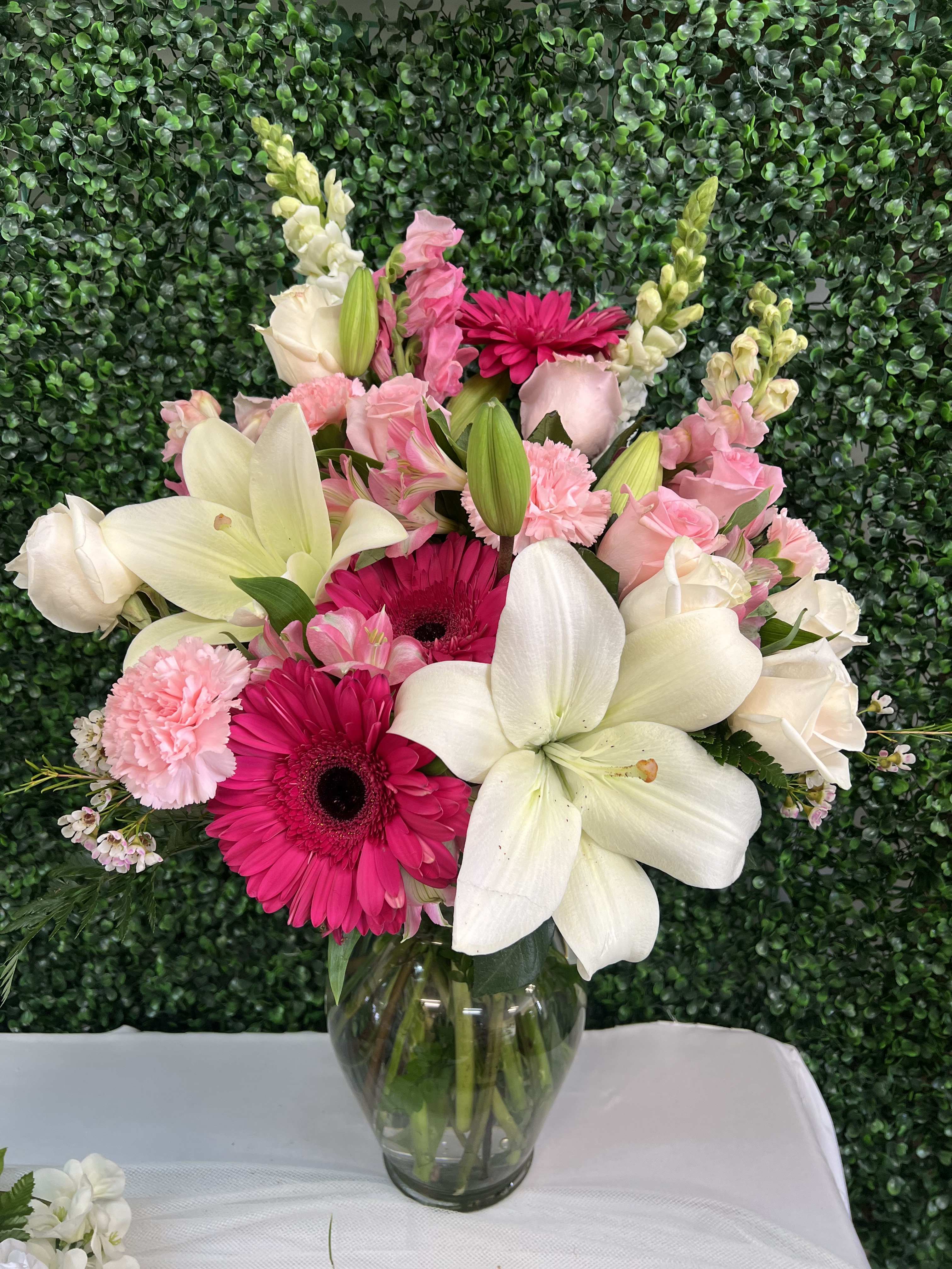 Pink and white mixed bouquet in a clear glass vase