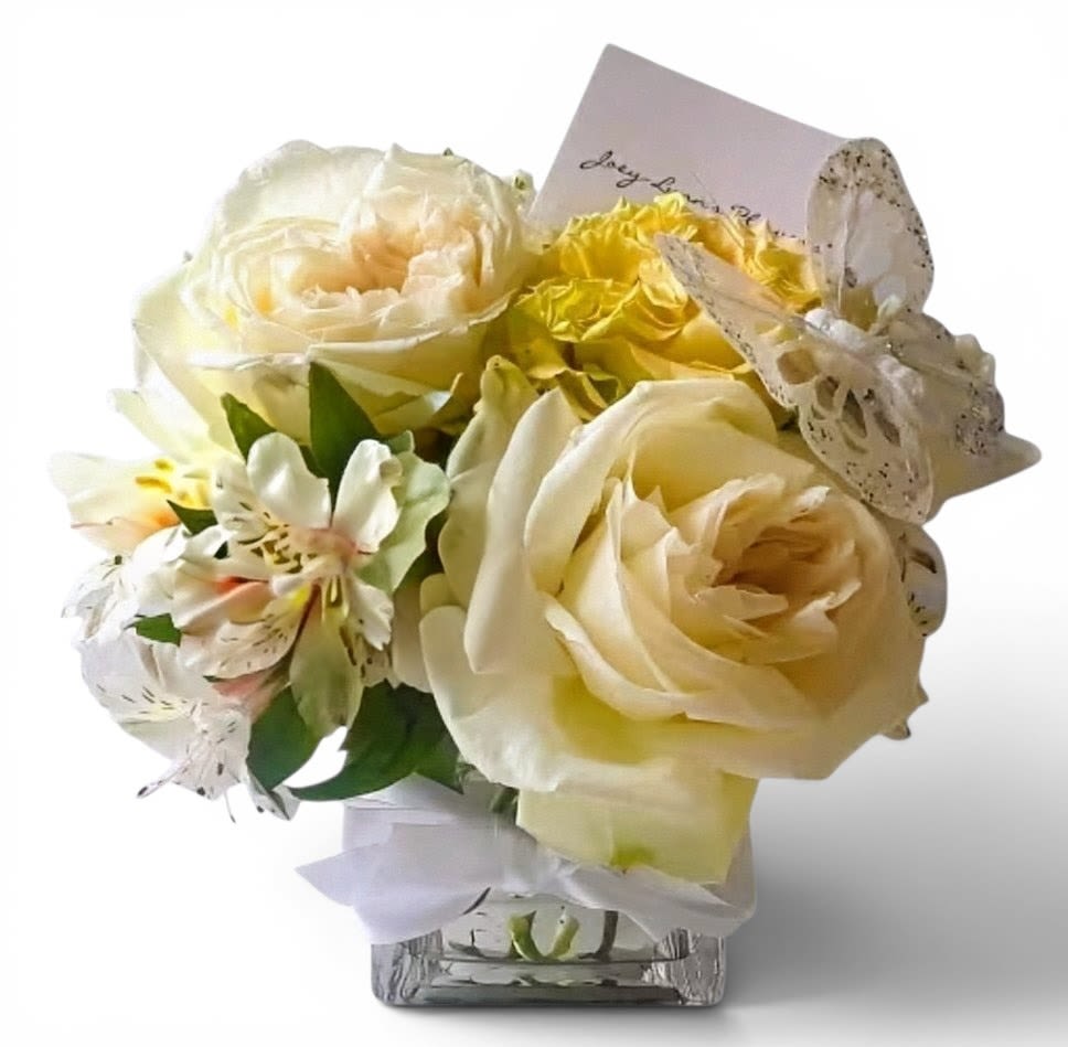 Petite Blossom Beauty Designer's Choice - Send this sweet gesture today to make them smile. Always made special and unique with white blossoms, roses and more.